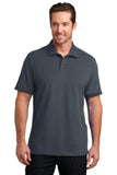 District Made Mens Stretch Pique Polo. DM325